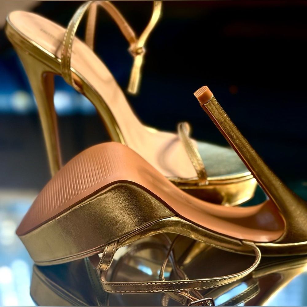 Gold platform strapped high heels. All new